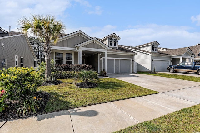 1741 Parish Way, Myrtle Beach, SC 29577 - view of front facade with board and batten siding, driveway, an attached garage, and a front yard