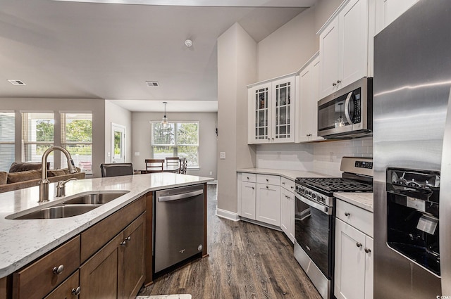1741 Parish Way, Myrtle Beach, SC 29577 - kitchen with appliances with stainless steel finishes, a sink, dark wood-style floors, white cabinetry, and light stone counters