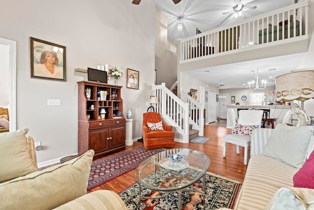 592 Riverward Dr Unit 592, Myrtle Beach, SC 29588 - living room with ceiling fan, stairway, wood finished floors, a high ceiling, and baseboards