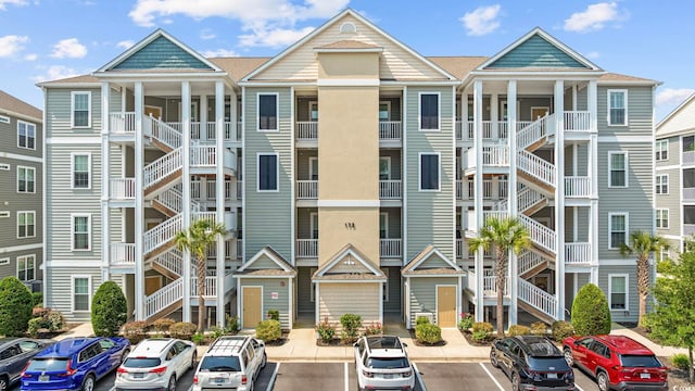 172 Ella Kinley Cir Unit 101, Myrtle Beach, SC 29588 - view of property featuring uncovered parking and stairway