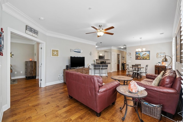 172 Ella Kinley Cir Unit 101, Myrtle Beach, SC 29588 - living area featuring a ceiling fan, light wood-type flooring, crown molding, a chandelier, and baseboards