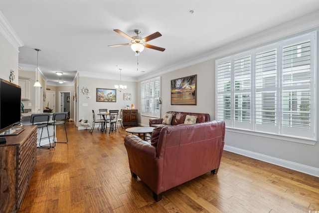 172 Ella Kinley Cir Unit 101, Myrtle Beach, SC 29588 - living area with ceiling fan, baseboards, wood finished floors, ornamental molding, and a chandelier