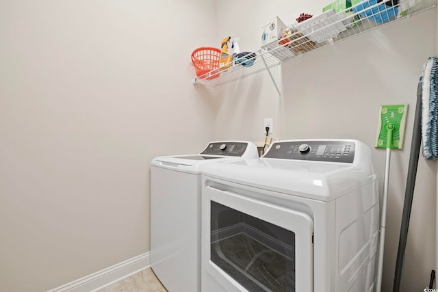 172 Ella Kinley Cir Unit 101, Myrtle Beach, SC 29588 - laundry room with washing machine and dryer and baseboards
