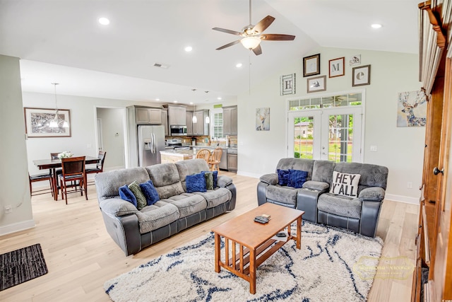 1013 Happy Ln, Galivants Ferry, SC 29544 - living area featuring light wood finished floors, ceiling fan, baseboards, french doors, and high vaulted ceiling