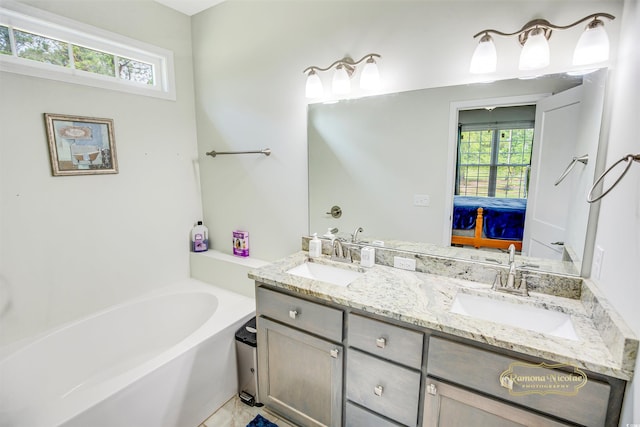 1013 Happy Ln, Galivants Ferry, SC 29544 - ensuite bathroom featuring plenty of natural light, double vanity, and a bath