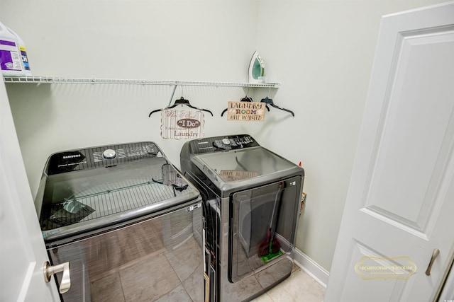 1013 Happy Ln, Galivants Ferry, SC 29544 - washroom with washing machine and dryer, baseboards, and tile patterned floors