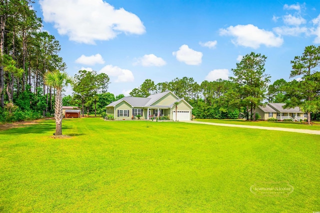 1013 Happy Ln, Galivants Ferry, SC 29544 - ranch-style home with a front lawn, driveway, and a garage