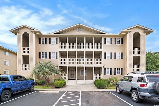 1900 Duffy St Unit L4, North Myrtle Beach, SC 29582 - view of building exterior featuring uncovered parking