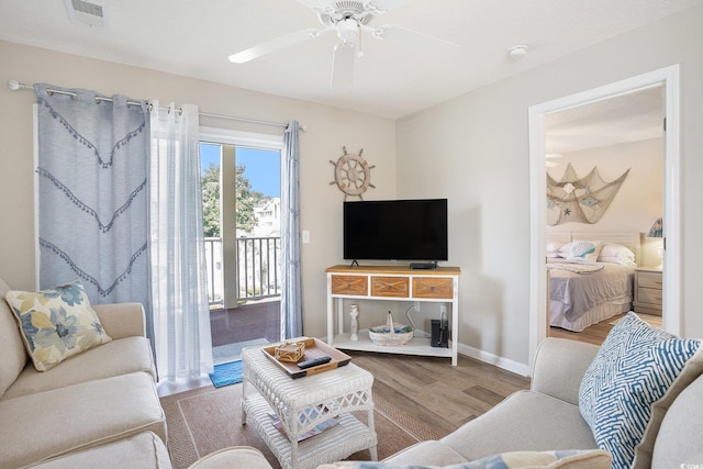 1900 Duffy St Unit L4, North Myrtle Beach, SC 29582 - living room with wood finished floors, a ceiling fan, and baseboards