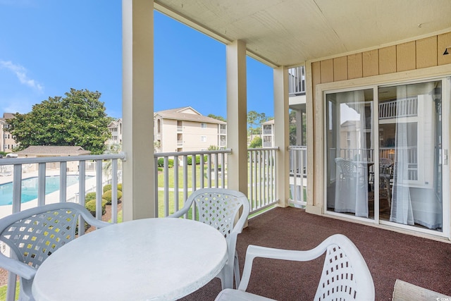 1900 Duffy St Unit L4, North Myrtle Beach, SC 29582 - balcony featuring outdoor dining area, a residential view, and view of pool area