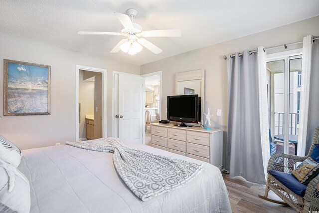 1900 Duffy St Unit L4, North Myrtle Beach, SC 29582 - bedroom featuring wood finished floors, access to outside, a ceiling fan, and ensuite bathroom