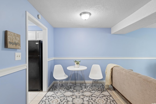 403 75th Ave N Unit C, Myrtle Beach, SC 29572 - tiled dining space featuring a textured ceiling and baseboards