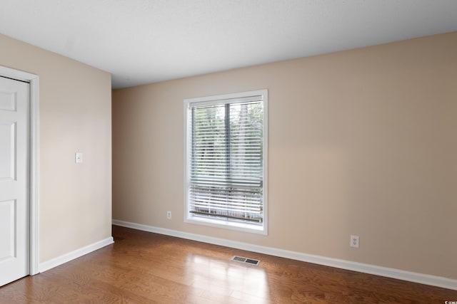 403 75th Ave N Unit C, Myrtle Beach, SC 29572 - spare room with wood finished floors and baseboards
