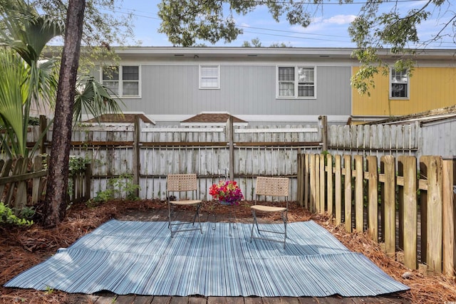 403 75th Ave N Unit C, Myrtle Beach, SC 29572 - wooden terrace featuring a fenced backyard and a patio area