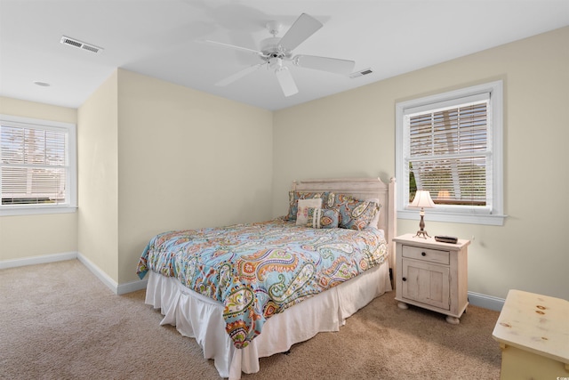 141 Cayman Loop, Pawleys Island, SC 29585 - bedroom featuring light colored carpet, baseboards, and ceiling fan