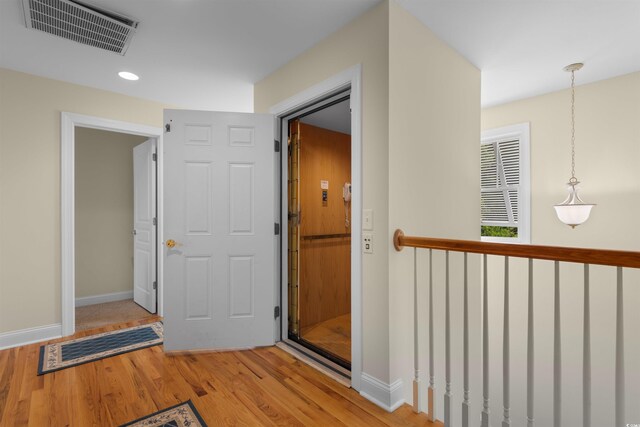 141 Cayman Loop, Pawleys Island, SC 29585 - hallway with wood finished floors, baseboards, and recessed lighting