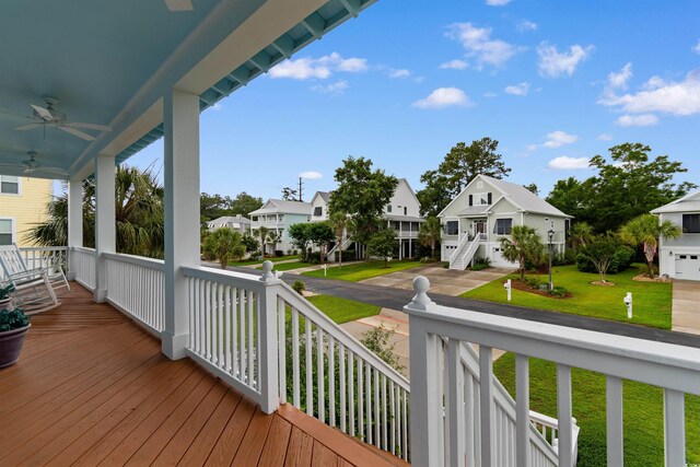 141 Cayman Loop, Pawleys Island, SC 29585 - porch with a residential view, ceiling fan, and a yard