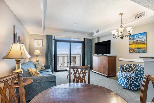 2600 N Ocean Blvd Unit 1406, Myrtle Beach, SC 29577 - living room featuring carpet, a chandelier, and a textured ceiling
