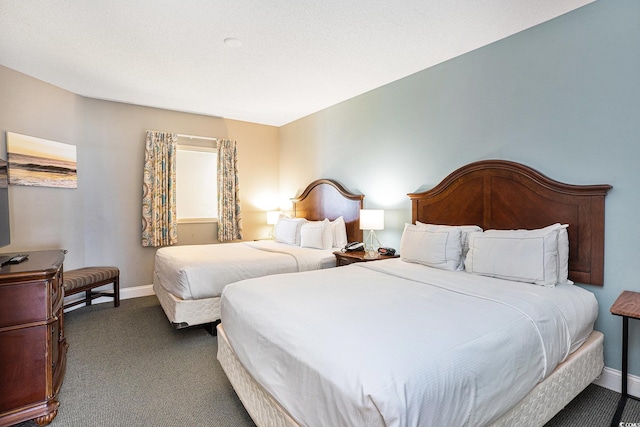 2600 N Ocean Blvd Unit 1406, Myrtle Beach, SC 29577 - bedroom featuring baseboards and dark colored carpet