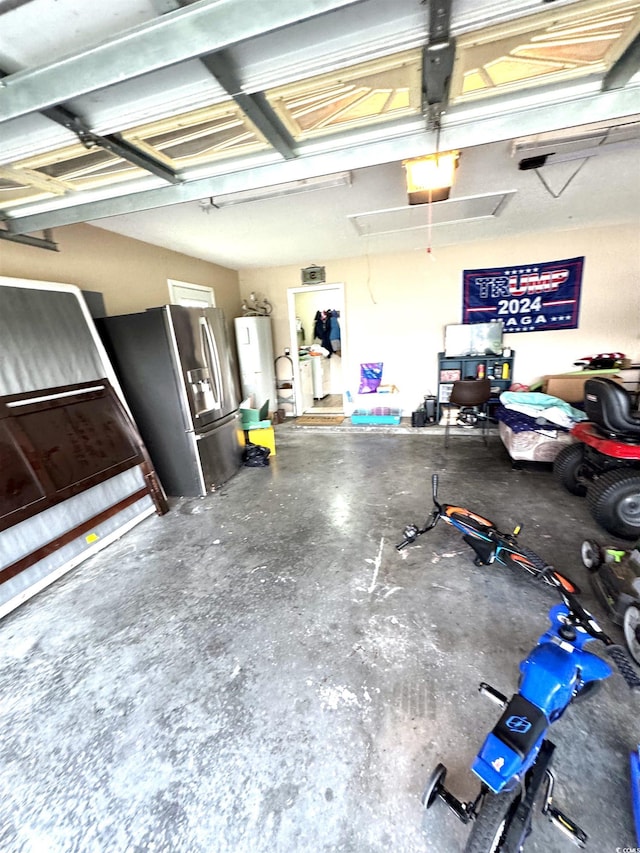2707 Canvasback Trl, Myrtle Beach, SC 29588 - garage featuring stainless steel fridge and water heater