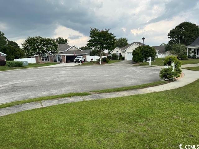2707 Canvasback Trl, Myrtle Beach, SC 29588 - view of asphalt road with street lighting, sidewalks, and a residential view