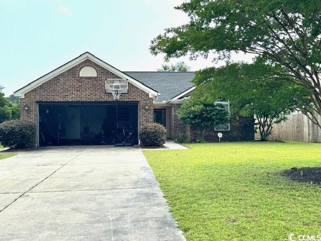 2707 Canvasback Trl, Myrtle Beach, SC 29588 - single story home with brick siding, driveway, and a garage