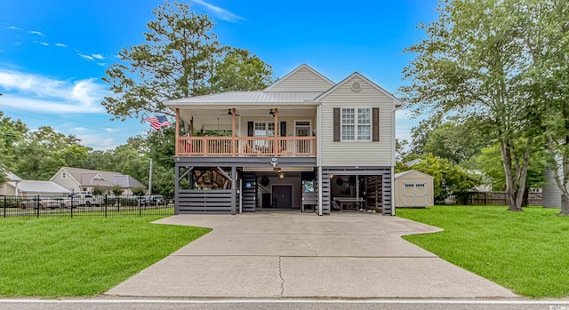 4600 Murrells Inlet Rd, Murrells Inlet, SC 29576 - coastal home with a carport, ceiling fan, stairway, a storage shed, and concrete driveway