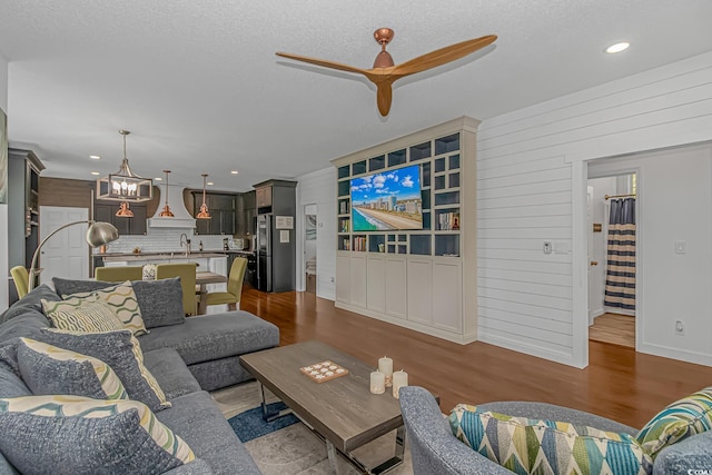 4600 Murrells Inlet Rd, Murrells Inlet, SC 29576 - living area with a ceiling fan, dark wood finished floors, a chandelier, recessed lighting, and stairway