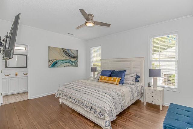 4600 Murrells Inlet Rd, Murrells Inlet, SC 29576 - bedroom featuring wood finished floors, crown molding, multiple windows, and a ceiling fan