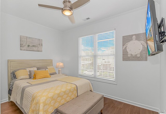 4600 Murrells Inlet Rd, Murrells Inlet, SC 29576 - bedroom with wood finished floors, ornamental molding, and a ceiling fan