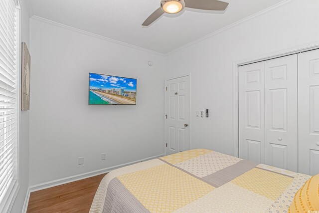 4600 Murrells Inlet Rd, Murrells Inlet, SC 29576 - bedroom featuring wood finished floors, a closet, ornamental molding, and a ceiling fan