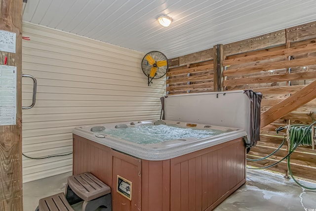 4600 Murrells Inlet Rd, Murrells Inlet, SC 29576 - misc room with a jacuzzi, wood walls, and unfinished concrete flooring