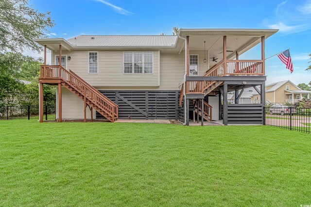 4600 Murrells Inlet Rd, Murrells Inlet, SC 29576 - rear view of property featuring stairway, a fenced backyard, a deck, and a metal roof