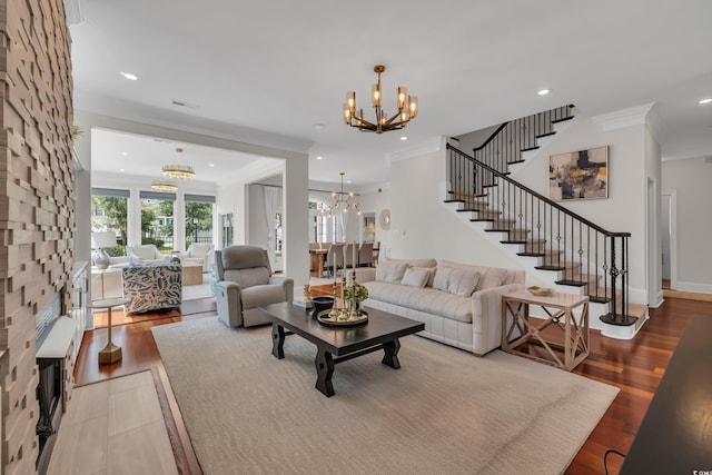1619 Eastover Ln, North Myrtle Beach, SC 29582 - living room featuring a chandelier, ornamental molding, recessed lighting, wood finished floors, and stairway