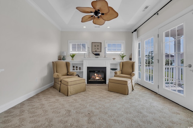 1619 Eastover Ln, North Myrtle Beach, SC 29582 - sitting room with carpet flooring, a glass covered fireplace, ceiling fan, crown molding, and recessed lighting