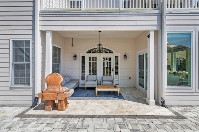 1619 Eastover Ln, North Myrtle Beach, SC 29582 - view of patio / terrace with a balcony, an outdoor living space, and french doors