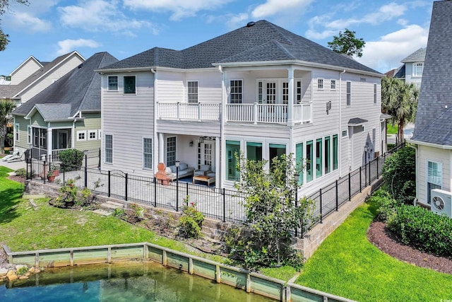 1619 Eastover Ln, North Myrtle Beach, SC 29582 - back of house featuring a balcony, an outdoor hangout area, a patio, ac unit, and a shingled roof