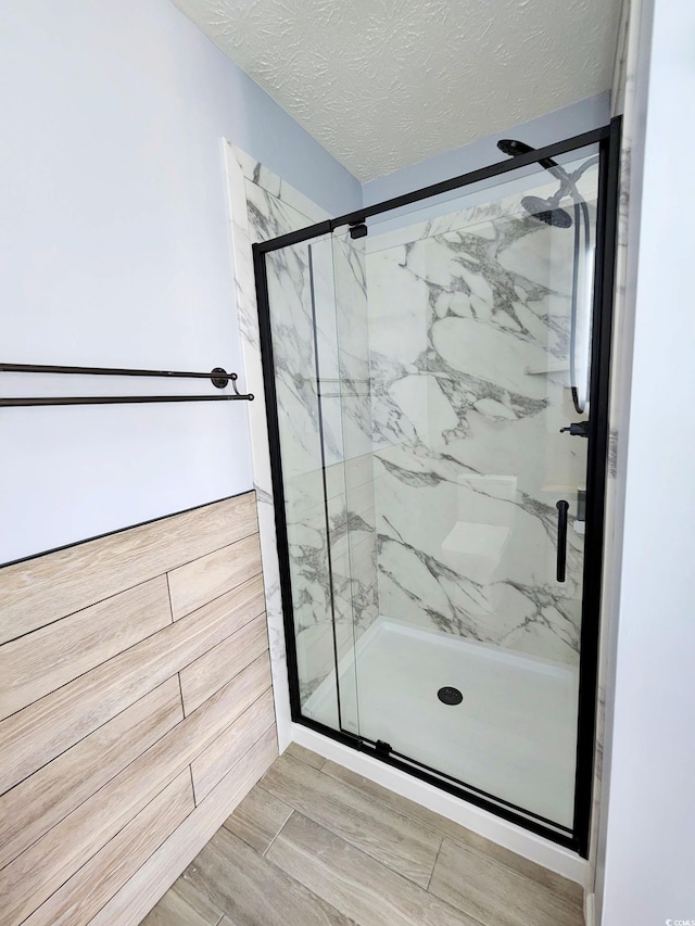 5031 Medieval Dr, Conway, SC 29526 - full bathroom featuring a marble finish shower and a textured ceiling