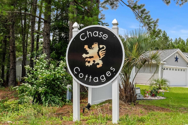 104 Browns Hollow Ct, Loris, SC 29569 - community / neighborhood sign featuring a garage and a lawn