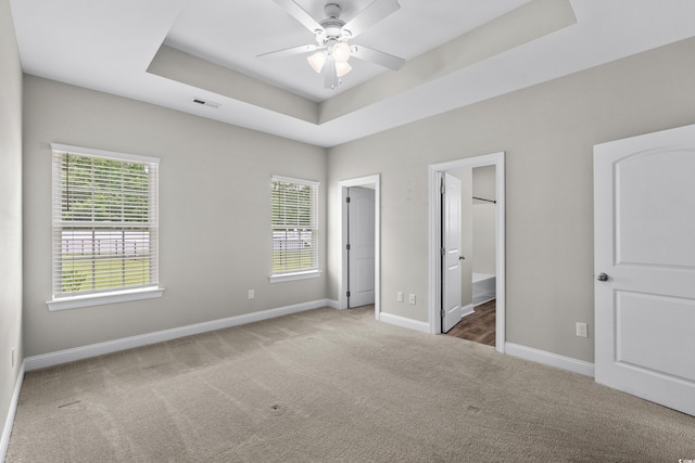 104 Browns Hollow Ct, Loris, SC 29569 - unfurnished bedroom with carpet, a raised ceiling, a ceiling fan, and connected bathroom