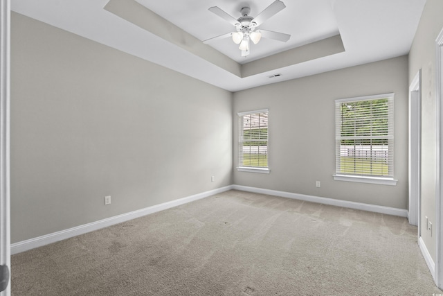 104 Browns Hollow Ct, Loris, SC 29569 - empty room featuring a ceiling fan, light carpet, and a tray ceiling