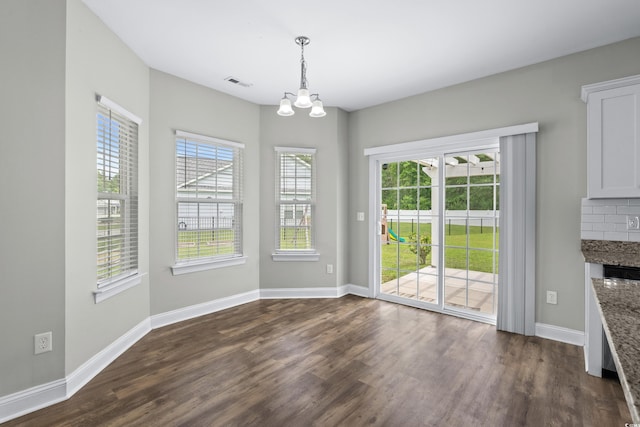 104 Browns Hollow Ct, Loris, SC 29569 - unfurnished dining area with dark wood finished floors, a chandelier, and a fireplace