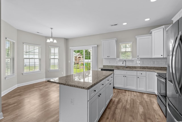 104 Browns Hollow Ct, Loris, SC 29569 - kitchen featuring appliances with stainless steel finishes, light wood-style floors, plenty of natural light, and recessed lighting