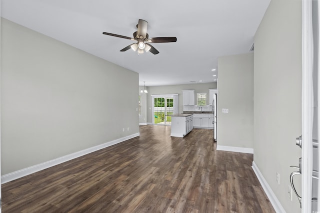 104 Browns Hollow Ct, Loris, SC 29569 - unfurnished living room with dark wood finished floors, a ceiling fan, and recessed lighting