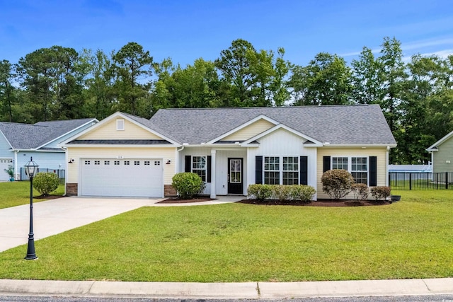 104 Browns Hollow Ct, Loris, SC 29569 - ranch-style house featuring a garage, driveway, and roof with shingles