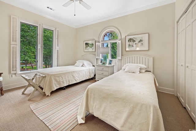 95 Sanderling Ave, Georgetown, SC 29440 - bedroom with carpet, a closet, multiple windows, ornamental molding, and baseboards