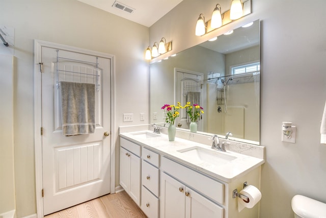 631 Rycola Cir, Surfside Beach, SC 29575 - full bath with double vanity, a shower, toilet, and wood finished floors