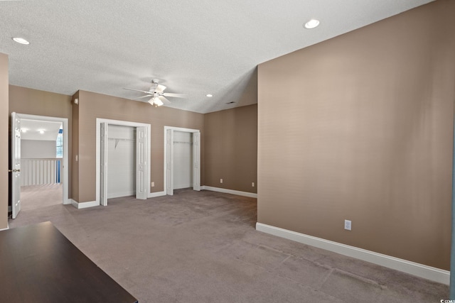 4378 Willoughby Ln Unit 4378, Myrtle Beach, SC 29577 - unfurnished bedroom with multiple closets, carpet floors, a textured ceiling, ceiling fan, and recessed lighting