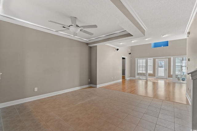 4378 Willoughby Ln Unit 4378, Myrtle Beach, SC 29577 - unfurnished living room with a textured ceiling, ceiling fan, ornamental molding, light tile patterned floors, and a tray ceiling