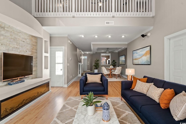 4378 Willoughby Ln Unit 4378, Myrtle Beach, SC 29577 - living area featuring crown molding, wood finished floors, a ceiling fan, and a high ceiling